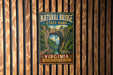 A vintage-style metal sign for Natural Bridge State Park in Virginia, featuring a scenic illustration of the bridge surrounded by lush greenery.