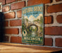 A vintage-style metal sign for Natural Bridge State Park in Wisconsin, featuring a scenic illustration of the bridge surrounded by trees and water.