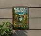 A vintage-style metal sign for Natural Bridge State Resort Park in Kentucky, featuring a scenic illustration of the bridge surrounded by lush greenery.