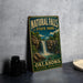 A vintage-style metal sign for Natural Falls State Park in Oklahoma, featuring an illustration of a waterfall surrounded by lush greenery.