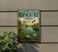 A vintage metal sign for "Kopacki Rit" in Croatia, featuring a heron and a boat on a lake surrounded by greenery.
