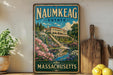 a vintage-style sign for the Naumkeag Estate in Massachusetts, with a painting of a house surrounded by flowers and a pond. The sign is displayed on a shelf next to a wooden cutting board and a potted plant.