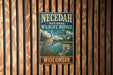 A vintage metal sign for the Necedah National Wildlife Refuge in Wisconsin, featuring an illustration of a bird and a lake.