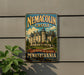 A vintage-style metal sign for the Nemacolin Castle in Pennsylvania, featuring an illustration of the castle and the text "A destination like no other PENNSYLVANIA"
