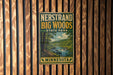A vintage-style metal sign for Nerstrand Big Woods State Park in Minnesota, featuring a scenic landscape with a river and forest.