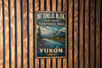 A vintage-style metal sign for Yukon, a fishing branch in the Territorial Park of the Yukon Territory, Canada.