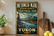 a vintage-style sign for Yukon, a territory park in Canada, with a scenic mountain landscape and a river.