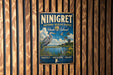 A vintage-style metal sign for the National Wildlife Refuge in Rhode Island, featuring an illustration of a bird and a serene landscape.