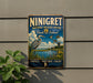 a vintage-style metal sign with a blue background and a bird illustration, mounted on a wall.