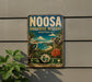a vintage-style sign for the Noosa Bioscape Reserve in Australia, with a koala and a bird depicted on the sign.