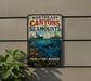 A vintage-style metal sign with the text "NORTHEAST CANYONS AND SEAMOUNTS" and an illustration of a ship sailing on the ocean, with a lighthouse on a rocky island in the background.