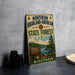 A vintage-style sign for the Northern Highland-American State Forest in Wisconsin, featuring a scenic illustration of a forest and a lake.