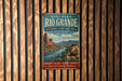A vintage-style metal sign for the Northern Rio Grande National Heritage Area in New Mexico, featuring a scenic landscape with a river and mountains.
