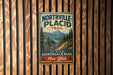 A vintage metal sign for Northville-Placid Trail, featuring a scenic mountain landscape and trail information.