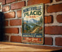 A vintage-style metal sign for the Northville-Placid Trail, mounted on a brick wall.