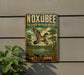 A vintage-style metal sign for the Noxubee National Wildlife Refuge in Mississippi, featuring a colorful illustration of a bird in flight over a pond.