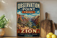 A vintage-style metal sign for Observation Point Trail in Zion National Park, Utah, featuring a scenic mountain landscape.