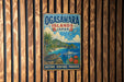 A vintage metal sign for Ogasawa Islands, Japan, featuring a tropical landscape with palm trees, a beach, and a boat on the water.