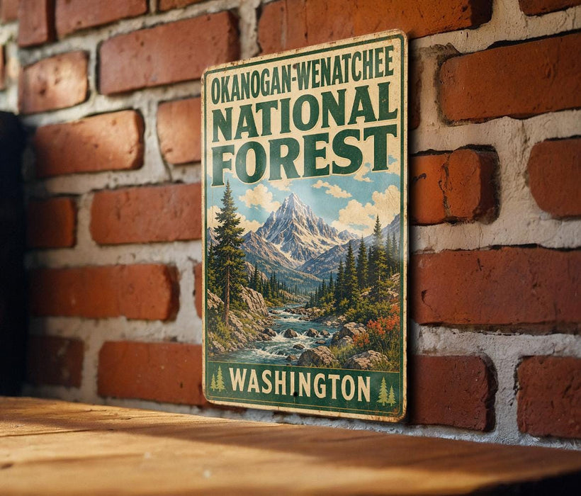 A vintage-style metal sign for the Okanogan-Wenatchee National Forest in Washington, featuring a mountain landscape with a river and pine trees.