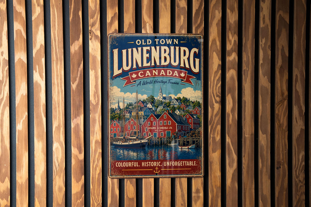 A vintage-style metal sign for "Old Town Lunenburg, Canada" is displayed on a wooden wall.
