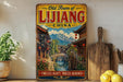 a vintage-style metal sign with a scenic illustration of a traditional Chinese village, including a bridge, surrounded by mountains. The sign is placed on a shelf next to a wooden cutting board and some potted plants.
