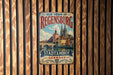 A vintage metal sign with the text "OLD TOWN OF REGENSBURG STADTAMHOF GERMANY" is displayed on a wooden wall.