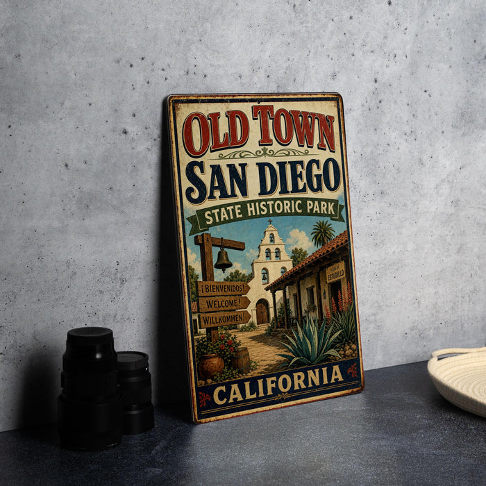 A vintage-style metal sign for Old Town San Diego, featuring an illustration of a historic building and a welcoming sign.