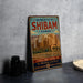 A vintage-style metal sign for the Old Walled City of Shibam, Yemen, featuring an image of the city's architecture and landscape.