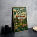 A vintage-style metal sign for Old Westbury Gardens in New York, featuring an illustration of a well-manicured garden with a large building in the background.