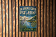 A vintage-style metal sign for the Old Woman Creek National Estuarine Research Reserve in Ohio, featuring a large blue heron and a scenic landscape.