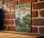 A vintage-style metal sign for Old Woman Creek State Nature Preserve in Ohio, featuring a large blue heron and a scenic landscape.