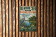 A vintage-style metal sign for Old Woman Creek State Nature Preserve in Ohio, featuring a blue heron and a scenic landscape.