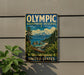 A vintage-style sign for the Olympic Biosphere Reserve in Washington, United States, featuring a scenic landscape with mountains, pine trees, and a body of water.