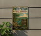 A vintage-style metal sign for Owen-Putnam State Forest in Indiana, featuring a scenic image of a forest landscape with a river and hiking trails.