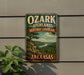 A vintage-style sign for the Ozark Highlands Heritage Landscape in Arkansas, featuring a scenic landscape with a river and mountains.