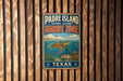 A vintage metal sign for Padre Island National Seashore's Marine Zone, featuring an illustration of marine life and the text "Padre Island National Seashore Marine Zone" and "Texas".
