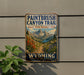 A vintage-style sign for the Paintbrush Canyon Trail in Grand Teton National Park, with a mountain landscape and colorful wildflowers.