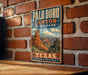 A vintage-style metal sign for Palo Duro Canyon State Park in Texas, featuring a scenic illustration of the canyon landscape.