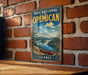 A vintage-style metal sign for the Parc National de Opecan, featuring a scenic landscape with a canoe on a lake, mounted on a brick wall.
