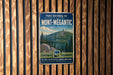 A vintage-style metal sign with the text "PARC NATIONAL DU MONT-MEGANTIC" and "QUÉBEC CANADA" is displayed on a wooden wall.