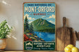 A vintage-style poster advertising the "Mont-Orford" region in Quebec, featuring a mountain landscape with a lake and pine trees.