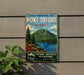 A vintage-style metal sign for the Park National du Mont-Orford in Quebec, featuring a scenic mountain landscape with a lake and pine trees.