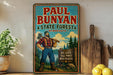 A vintage-style poster of Paul Bunyan, a famous lumberjack, is displayed on a wall next to a wooden cutting board and some kitchen utensils.