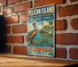 A vintage-style metal sign for the Pelican Island National Wildlife Refuge in Florida, featuring a pelican and a tropical beach scene.