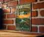 A vintage-style metal sign for the Pennyville State Forest in Kentucky, featuring a scenic landscape with a river, trees, and a sunset.