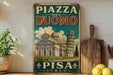 A vintage-style sign for Piazza del Duomo in Pisa, Italy, featuring an illustration of the Leaning Tower of Pisa.