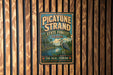 A vintage-style metal sign for the Pico Yune Strand State Forest in Florida, featuring a blue background with a bird illustration and text.