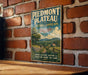 A vintage-style metal sign for Piedmont Plateau, Virginia, featuring a scenic landscape with a path, trees, and a house.