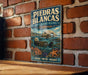 A vintage-style metal sign for the Piedras Blancas State Marine Reserve in California, featuring an illustration of an octopus and other marine life.