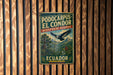 A vintage metal sign with text and an illustration of a bird, mounted on a wooden wall.